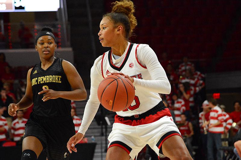 Freshman guard Lucky Rudd dribbles the ball during the game. The Wolfpack faced off against UNC Pembroke in Reynolds Coliseum on Friday Nov. 4. The Pack won against the Braves in the first exhibition game, 96-41.&#160;