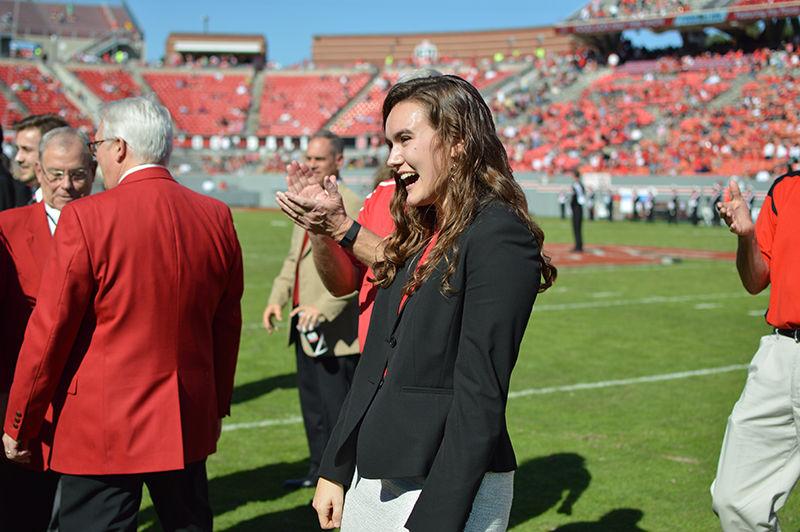 Kati Scruggs, a senior studying nutrition science and women&#8217;s and gender studies, is given the Leader of the Pack award during the homecoming game against Boston College on Saturday, Oct. 29.