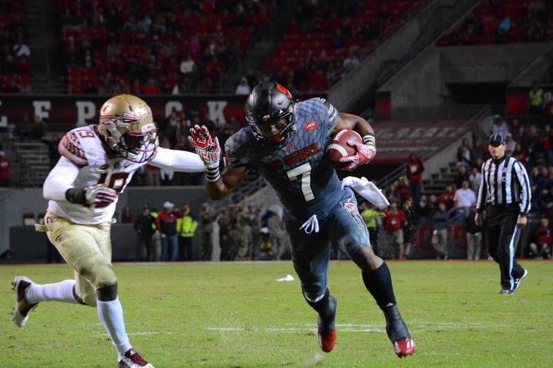 Sophomore running back Nyheim Hines rushses the ball during the Military Appreciation game against the Florida State University Seminoles in Carter-Finley Stadium on Saturday. Hines received for 124 yards with 60 yards for kickoff returns. The Seminoles beat the Wolfpack, 24-20.