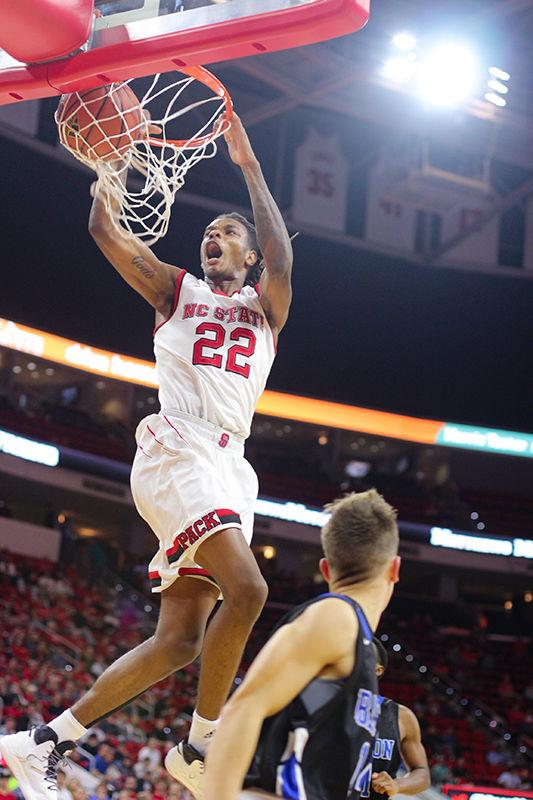Sophomore guard forward hybrid Shaun Kirk dunks. Kirk made five shots during the game. The NC State basketball team beat Barton College 112-60 on Monday at PNC Arena.