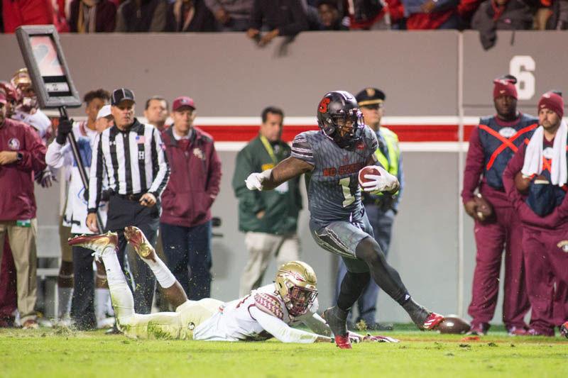 Junior tight end Jaylen Samuels breaks a tackle on the way to a 23-yard touchdown rush. After getting nearly no looks or touches against Boston College, Samuels' presence was felt with 29 yards on the ground and 31 through the air. The Wolfpack was unable to complete the fourth quarter ending in a 24-20 loss to Florida State on Saturday in Carter-Finley Stadium.