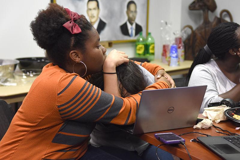 Sydnee Callender, a freshman studying mechanical engineering, consoles Diana Vallejo, a freshman studying art studies, after more electoral votes are called for Donald Trump. The African American Cultural Center hosted and co-sponsored the election watch party with the Nubian Message.&#160;