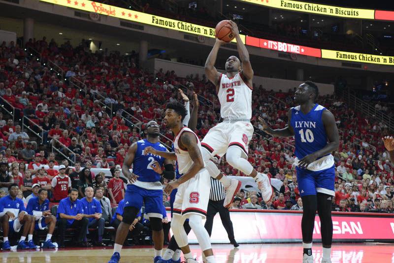 Redshirt sophomore guard Torin Dorn goes up for two points. The men's basketball team played in their first exhibition match against Lynn University on Thursday in PNC Arena with a final score of 100- 66.