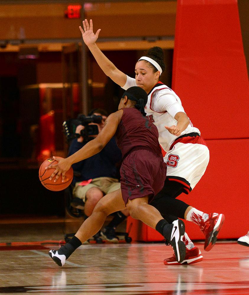 Senior guard Miah Spencer defends a Maryland Eastern Shore player during the game on Monday in Reynolds Coliseum. The Wolfpack held the lead throughout the entire game and defeated Maryland Eastern Shore by a score of 77-58.