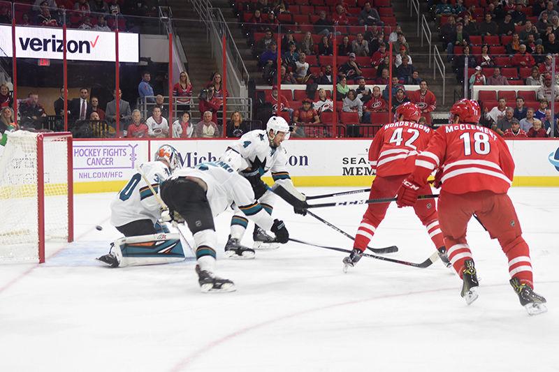 Hurricanes forward Joakim Nordstrom backhands the puck past Sharks goalie Aaron Dell in the third period. The Carolina Hurricanes defeated the San Jose Sharks 1-0 in PNC Arena on Tuesday. Nordstrom recorded his first goal of the season off an assist from forward Viktor Stahlberg. Hurricanes goalie Cam Ward also earned his first shutout of the season during Tuesday's game.