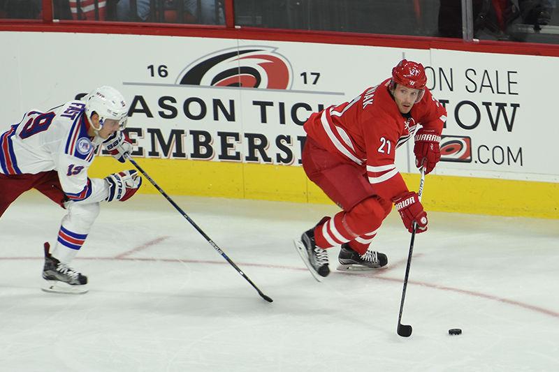 Hurricanes forward Lee Stempniak looks for an open pass during the home opener against the New York Rangers on Oct. 28 in PNC Arena. Stempniak was acquired by the Hurricanes over the summer, signing a two-year, $5 million contract.