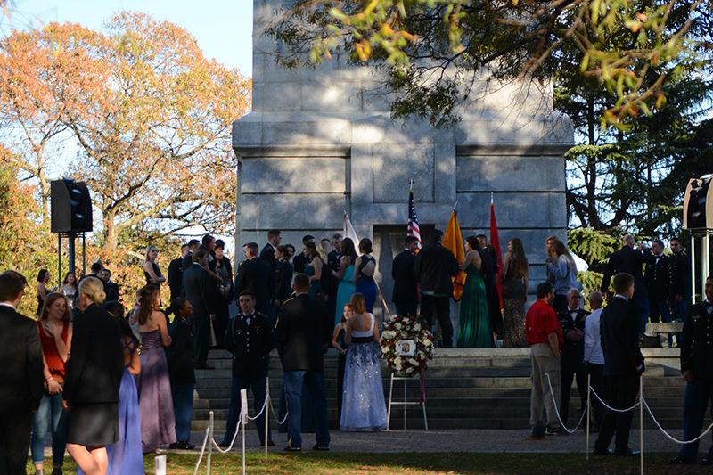 Ceremony attendees gather at the base of the Belltower in celebration of the NC State ROTC's 100th anniversary on Friday. Current students and program alumni attended the ceremony, and laid a wreath at the base of the Belltower in celebration.