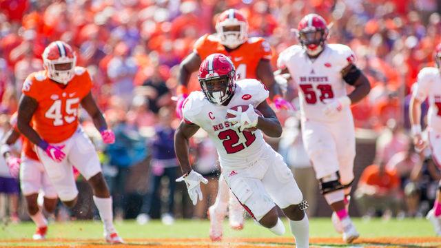 Senior running back Matt Dayes rushes up the field. The Wolfpack suffered a heartbreaking 24-17 overtime defeat at Death Valley in Clemson, SC on Oct. 15, 2016.