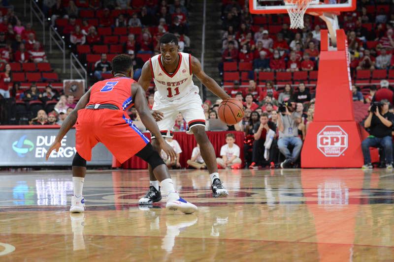 Freshman guard Markell Johnson faces off with St. Francis player Yunus Hopkinson in PNC Arena on Nov. 13, 2016. Johnson played for 21 minutes during the Wolfpack's 86-61 win over St. Francis Brooklyn College, scoring six points and recording three assists.
