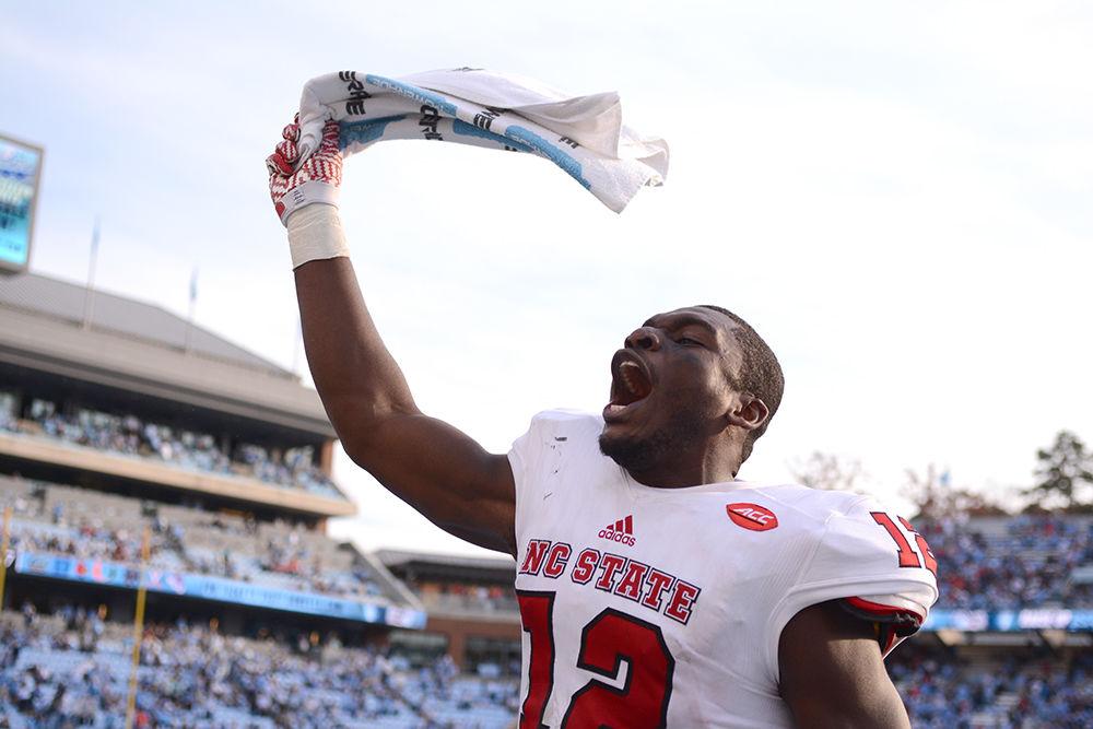 Stephen Louis, a sophomore wide receiver, celebrates after the victory over UNC-CH. Louis scored the first touchdown of the game for the Pack on Friday in Kenan Stadium. The Wolfpack defeated the Tar Heels 28-21.