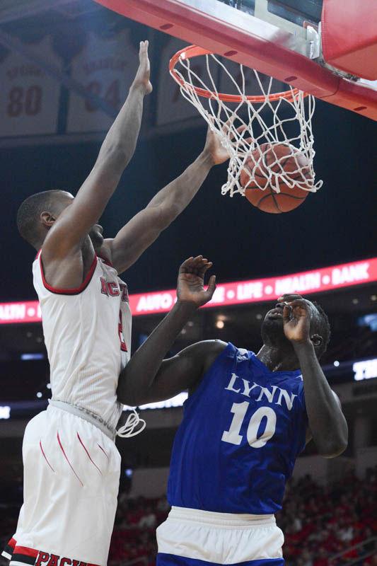 Sophomore guard Torin Dorn dunks on Kande Vieux from Lynn University. The Pack won their first exhibition match with a final score of 100-66 in PNC Arena on Thursday.