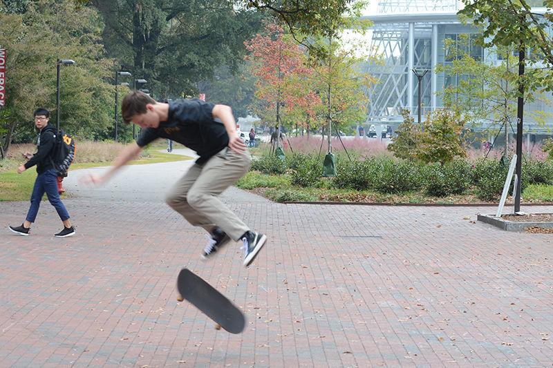 Mark Sommers, a freshman studying engineering, practices his kick flips next to Wolf Plaza on Wednesday morning. Sommers has been skateboarding for four years and is constantly working on learning new tricks and meeting new skaters."Skating is what I have always enjoyed doing,&#8221; Sommers said. &#8220;I love being able to talk to all the other skaters on campus and learn from them." In addition to Sommers, many other frequent skaters go to Wolf Plaza to skate around and try some new tricks.
