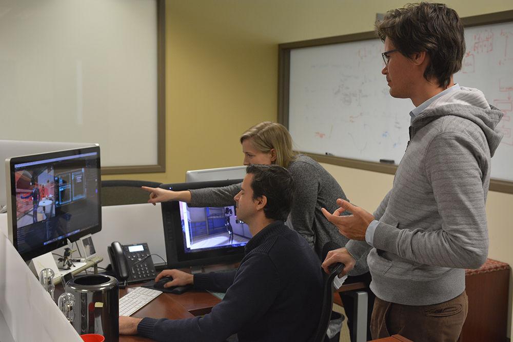 Kirby Culbertson (left), Megan Frankosky (back) and Philip Buffum work on Engage, a game created by the Center for Educational Informatics and the University of Florida. The game was designed to broaden interest in computer science for middle school students. Engage has been implemented in some middle schools in Wake County.&#160;