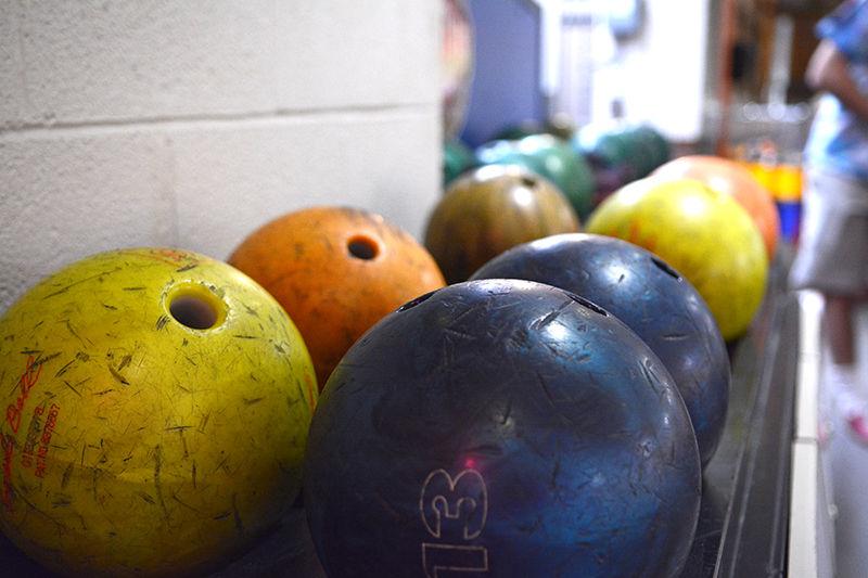 Bowling balls sit in racks along the back wall of The Alley on Oct. 22. The Alley is a local bowling alley on Hillsborough Street across from D.H. Hill Library, but will close for good on Nov. 26.