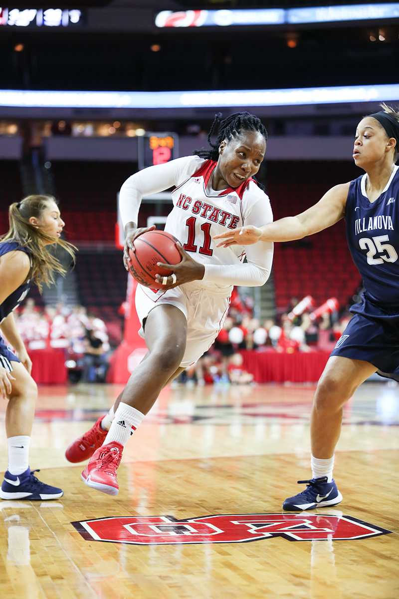 Junior forward Jennifer Mathurin splits two Wildcat defenders versus the Villanova Wildcats on Nov. 13, 2015 at PNC Arena.&#160;