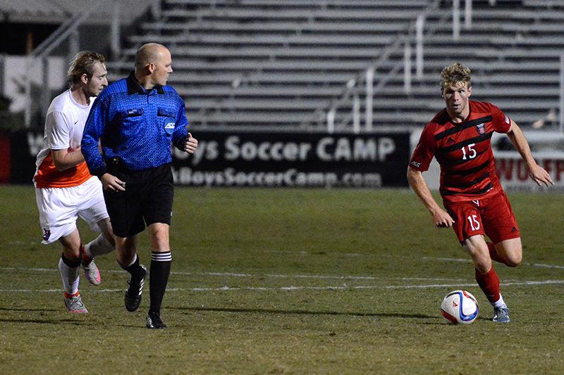 Sophomore midfielder Cameron Steele sprints with the ball down the field in the 1-4 loss to Clemson on NC State men&#8217;s soccer's senior night, Oct. 30, 2015 at Dail Soccer Stadium.