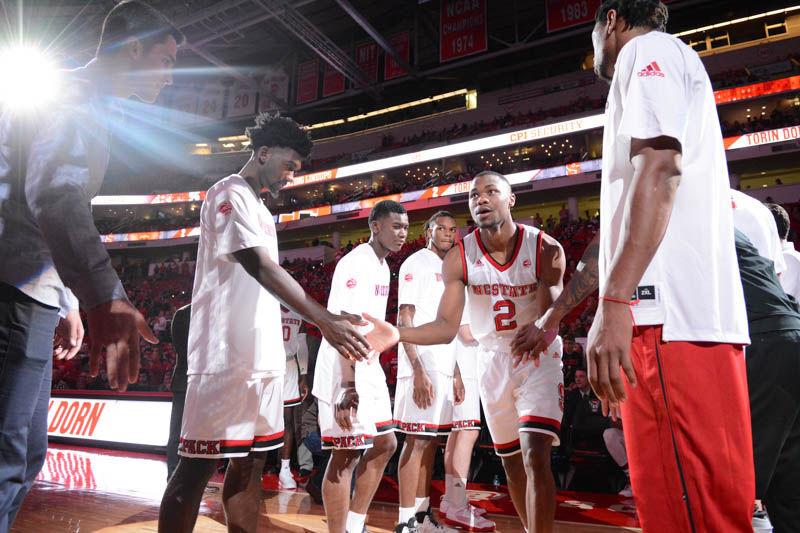 Redshirt sophomore guard Torin Dorn high-fives his teammates while being introduced at the men's basketball game against St. Francis Brooklyn College on Sunday, Nov. 13, 2016. Dorn scored a team-high 21 points against the Terriers in the Wolfpack's 86-61 victory in PNC Arena.