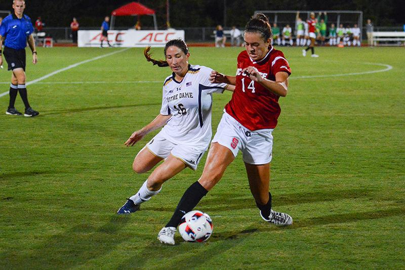 Sophomore midfielder Taylor Porter shields the ball from a Notre Dame player. Porter took one shot during the game which was not on goal. The NC State women&#8217;s soccer team lost to Notre Dame 0-1 at Dail Soccer Stadium on Sept. 22.&#160;