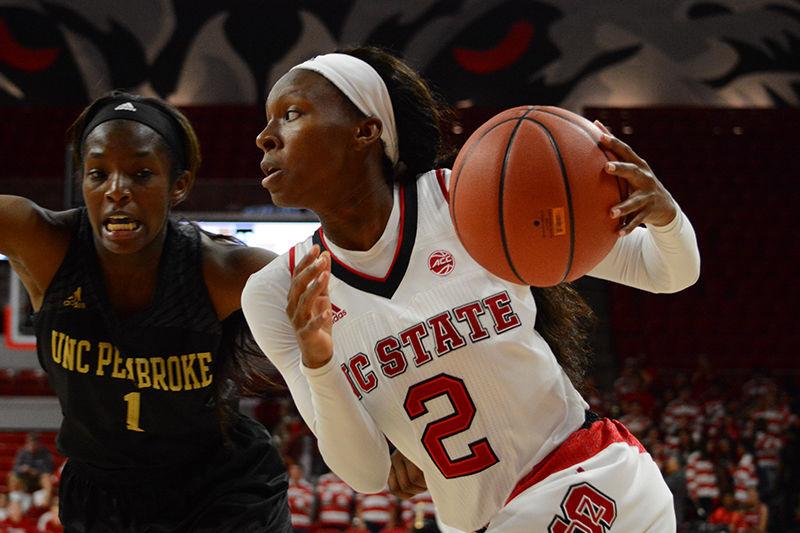 Redshirt freshman guard Kaila Ealey dribbles the ball up to the hoop. The Wolfpack faced off against UNC-Pembroke in Reynolds Coliseum on Friday. The Wolfpack won against the Braves in the first exhibition game, 96-41.