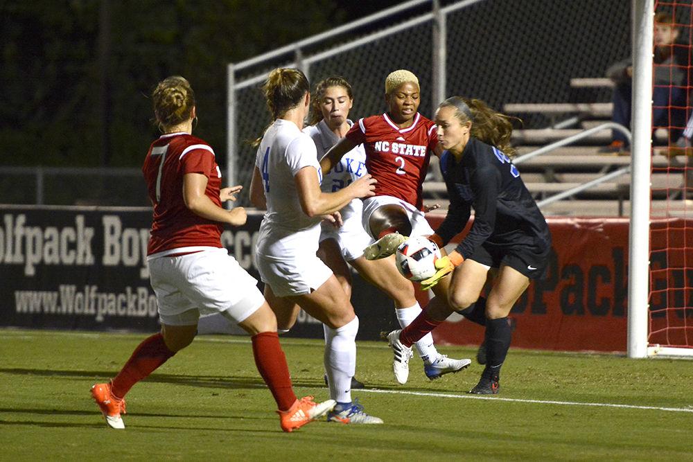 Freshman midfielder Tziarra King attempts to kick the ball against Duke during a soccer match on Oct. 9. Duke would go on to win the game against the Wolfpack, 3-1, in Dail Soccer Stadium.