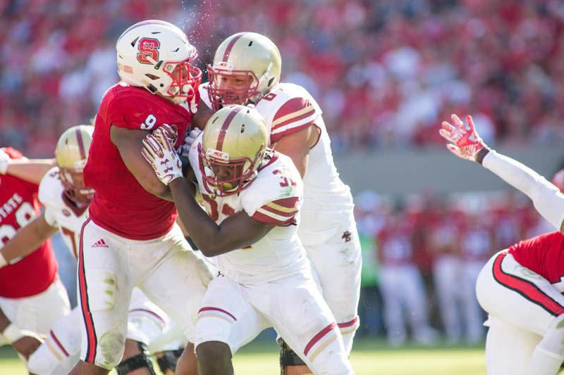 Junior defensive end Bradley Chubb is double teamed during the 21-14 homecoming loss to Boston College on Saturday in Carter-Finley Stadium.
