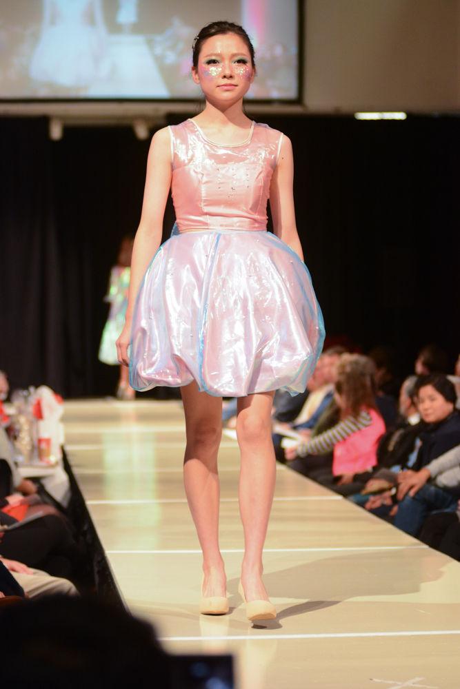 A model wears designs by Cindy Wang at the College of Textile Threads Seinor Showcase. Wang wants to make fashion not just about gorgeous clothing, but also about making a statement. She has always cared about the environment and the sustainability of our world and wishes to spread knowledge of how harmful pollution is to the world through her passion for fashion by showing the beauty of the sea in her design.