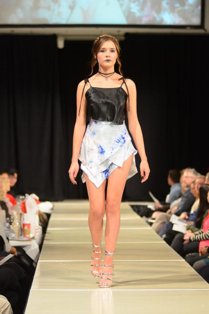 A model walks in the COT Threads Senior Showcase for designer Hannah Wilkinson. The collection is about a free spirited, introverted girl who thrives in the night. She is a creative who feels she has to escape modern technology and search for a new meaning in the depths of her dreams. She embraces darkness as a scenery of blurred reality, dressed in embroidered sheer voile, delicate velvet and natural dyed silk.