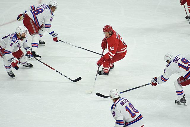 Hurricanes forward Jeff Skinner weaves through multiple Rangers players to score during the first period. Skinner earned two goals and an assist during the Canes' home opener vs. the New York Rangers held in PNC Arena on Friday. The Hurricanes defeated the Rangers 3-2.