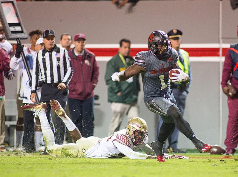 Junior tight end fullback hybrid Jaylen Samuels breaks a tackle on the way to a 23-yard touchdown rush. After getting nearly no looks or touches against Boston College, Samuels' presence was felt with 29 yards on the ground and 31 through the air. The Wolfpack was unable to complete the fourth quarter ending in a 24-20 loss to Florida State on Saturday Nov. 5 in Carter-Finley Stadium.