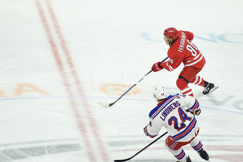 Hurricanes forward Teuvo Teravainen carries the puck in the neutral zone during Carolina's home opener against the New York Rangers on Oct. 28 at PNC Arena. The Hurricanes defeated the Rangers 3-2 with two points from Jeff Skinner and one from Bryan Bickell.