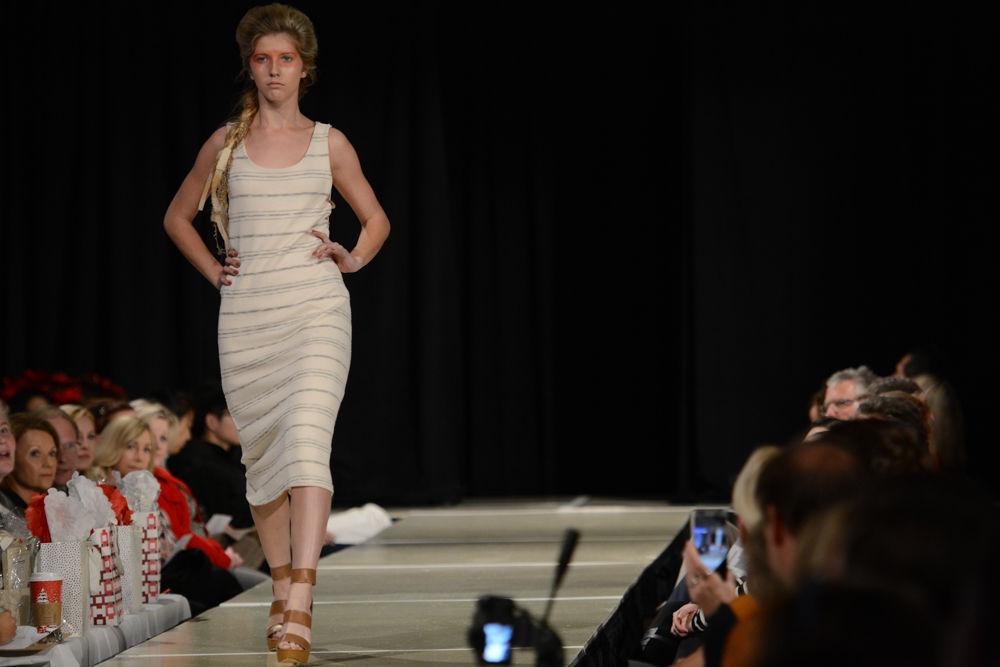 A model models a piece from the When Land Meets Sea Collection by Anna Page at the 2016 Threads Senior Collection Showcase that took place on December 3rd at the college of textiles. The collection is inspired by Anna's travels around various Carrabian countries. Her pieces represent a blending of the coast, horizon and sea and are designed for the adventourous, bold and confident modern woman.