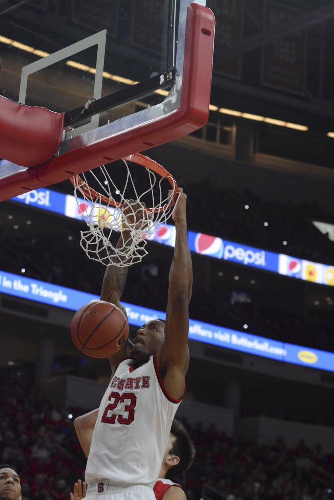 Freshman Ted Kapita dunks over players from Boston University. Kapita had a good run in the game before fouling out, although he only scored 5 points he played smart defenseively and offensively which helped the team tremendously. Overall the Men's Basketball Team had a close game with a final score of 77-73 over Boston University.
