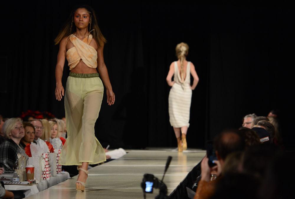 A model models a piece from the When Land Meets Sea Collection by Anna Page at the 2016 Threads Senior Collection Showcase that took place on December 3rd at the college of textiles. The collection is inspired by Anna's travels around various Carrabian countries. Her pieces represent a blending of the coast, horizon and sea and are designed for the adventourous, bold and confident modern woman.