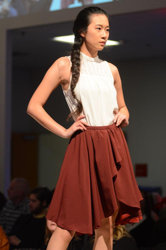A model walks the runway at the COT Threads Senior Showcase held at the College of Textile on Dec. 3 2016 for designer, Jisu Kim. Kim was inspired by how sexualized and objectified a women&#8217;s body is now in the fashion industry. She created a line of feminine, soft business wear and evening wear for beautiful and confident women.