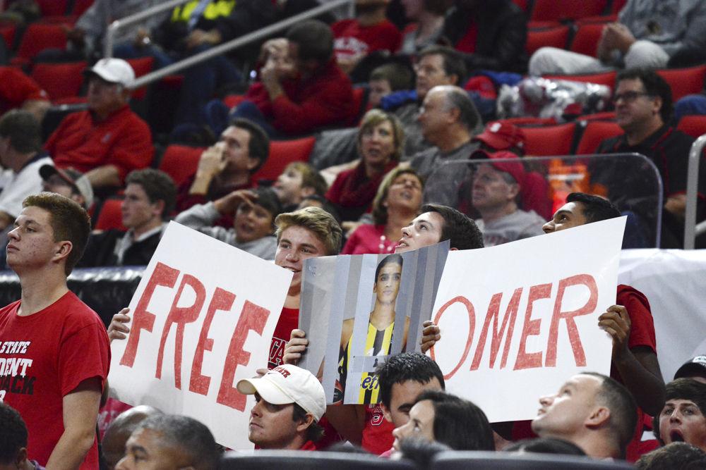 Students hold up signs reading "free Omer" referring to the Freshman player Omer Yurveson who was suspended for 9 games at the begining of the season. Yurveson will be eligible to play again in the game versus Fairfield University on December 18.