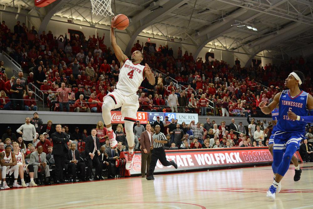 Freshman guard, Dennis Smith Jr., drives up to the basket in overtime during the game against Tennessee State University. The Wolfpack won the game on Saturday, December 10, 2016, at Reynolds Coliseum with a score of 67-55.