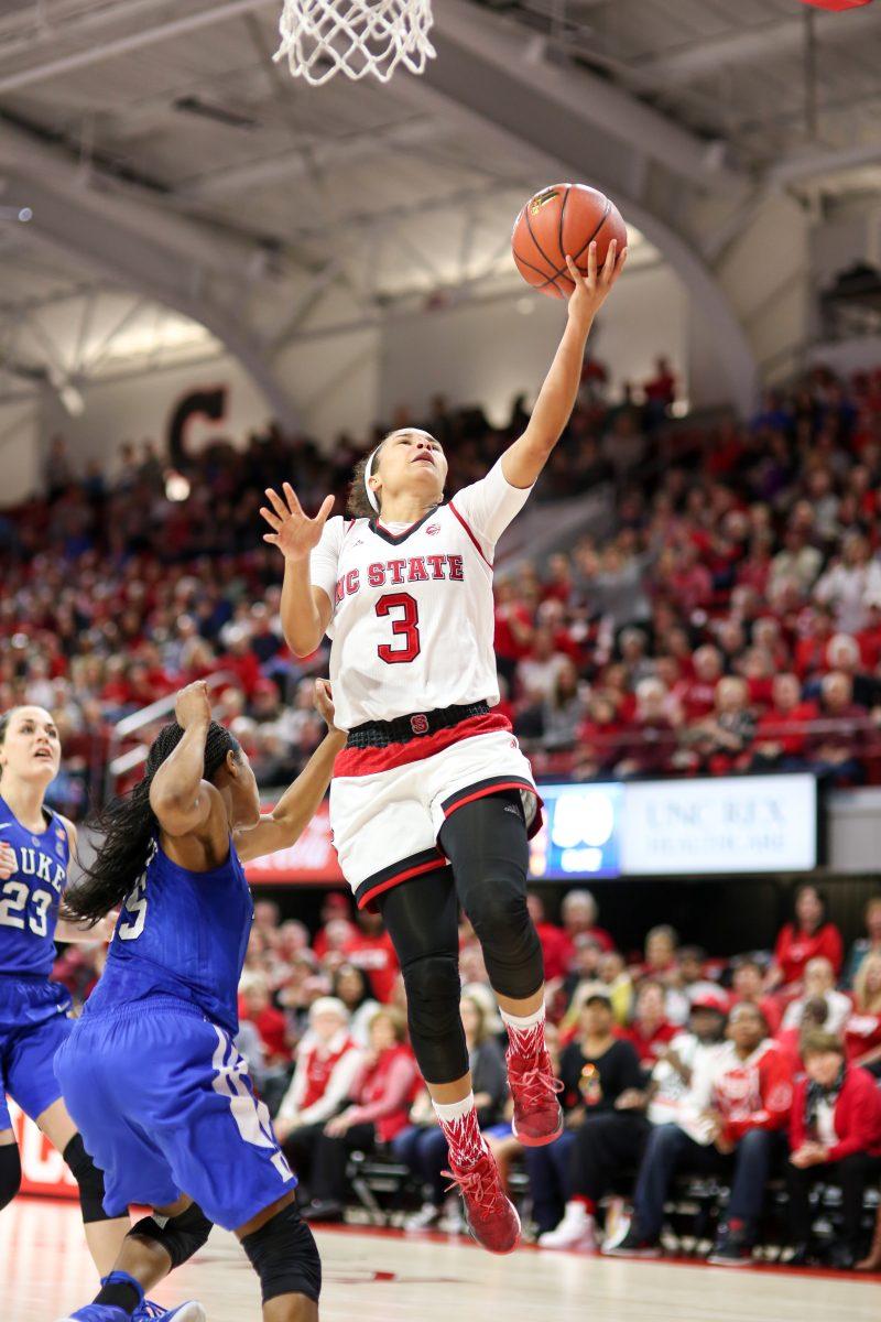 Senior guard Miah Spencer goes for a quick layup on transition. Spencer had a relatively quiet day with six points and four rebounds, but the Wolfpack was able to overcome a 0-12 three-point drought in the second half to come away with the 55-52 win over No. 12 Duke in Reynolds Coliseum on Jan. 15.