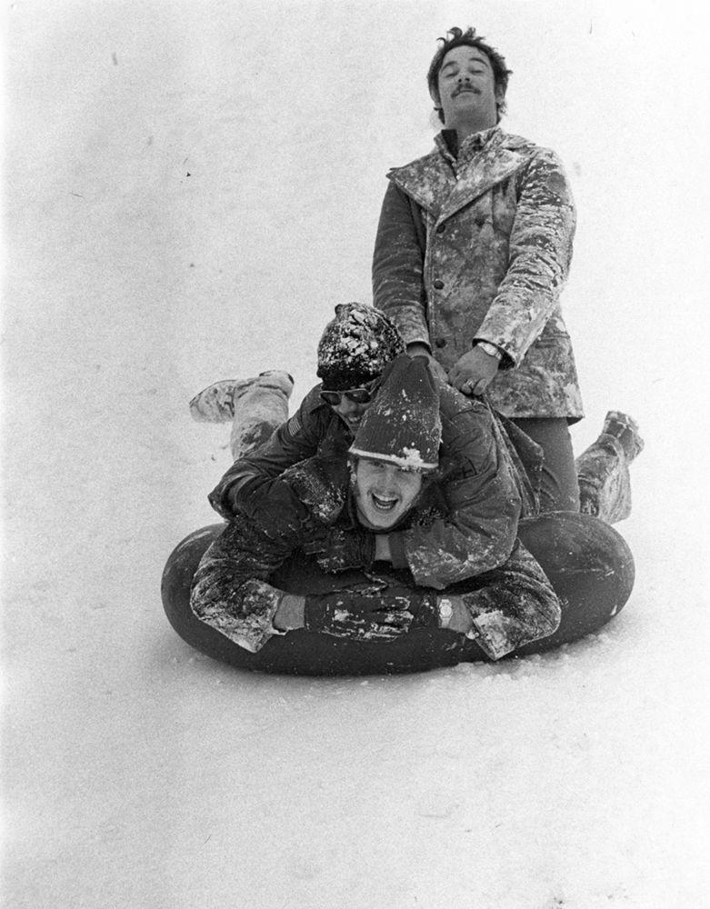 Students brace themselves as they sled down a hill in the late &#8216;70s.&#160;