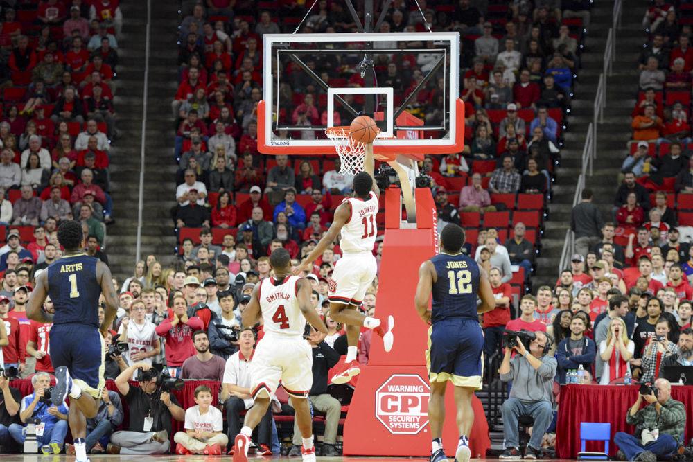 Freshman Markell Johnson in mid air as he scores over Pitt's Men's Basketball team. The Wolfpack is now 2-4 in ACC games and 13-6 overall this season. The game versus Pittsburgh ended with a final score of 79-74 in PNC Arena on Tuesday.
