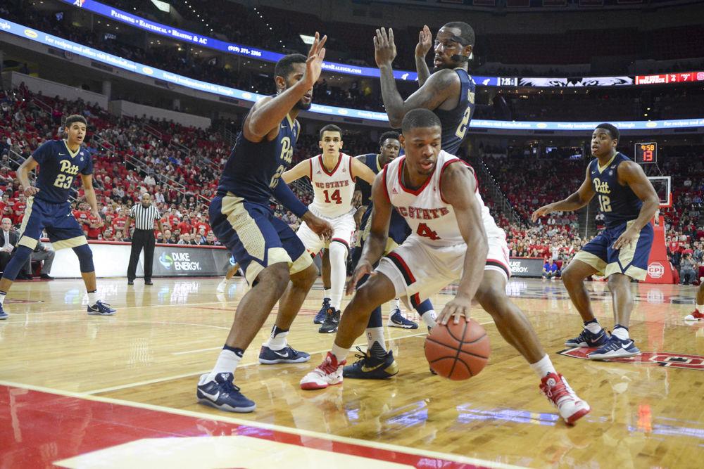 Freshman guard Dennis Smith Jr. gets trapped by two players from Pittsburgh. Dennis played well offensively and defensively to help the Wolfpack take home the win over Pittsburgh on Tuesday in PNC Arena.