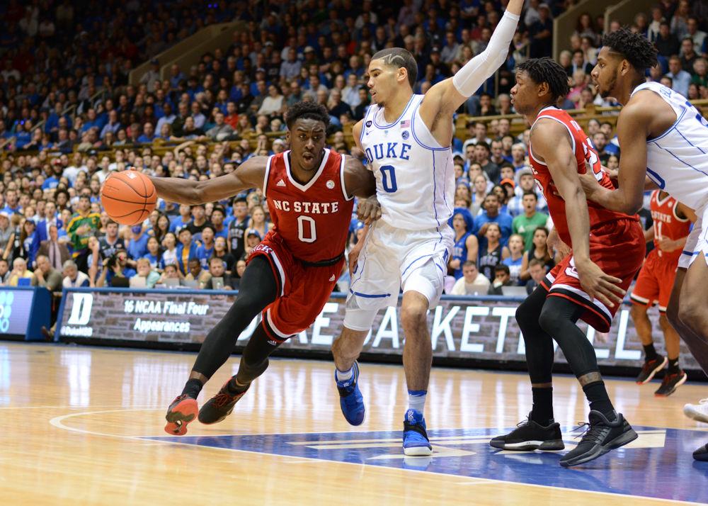 Junior forward Abdul-Malik Abu sprints past a Duke player. The NC State men's basketball team beat Duke 84-82 at Cameron Indoor Stadium on Jan. 23.