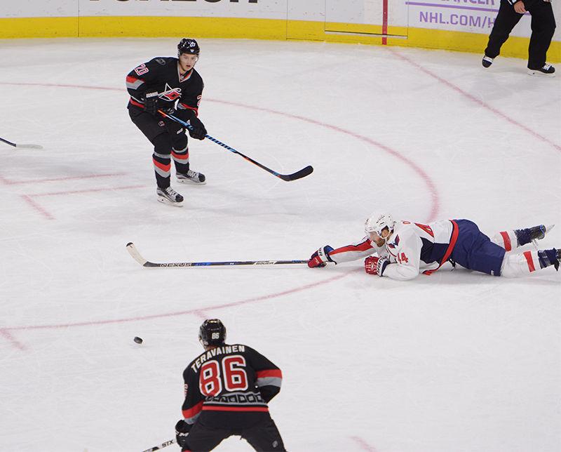 Hurricanes forward Sebastian Aho sets up forward Teuvo Teravainen to score during the first period of the game against the Washington Capitals in PNC Arena on Saturday. The play resulted in the Hurricanes' second goal of the night, leading them to a 5-1 victory over the Capitals. Aho finished the game with one assist and two goals, his first two in the NHL.