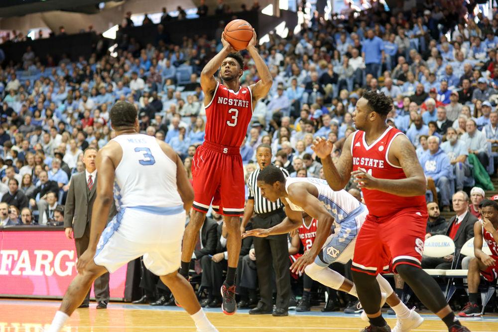 Redshirt senior guard Terry Henderson pulls up for a three point during the 107-56 loss to UNC-CH in the Dean Smith Center on Jan. 8.