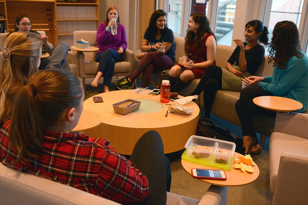 A group of students, including Anila Yadavalli, a graduate student studying mathematics, eat and socialize in a circle in room 4104 in SAS Hall Wednesday. Yadavalli is president of the NC State student chapter of the Association for Women in Mathematics, which hosts a series of Weekly Brown Bag Lunches every Wednesday at noon. The organization has had weekly lunches since 2013 and according to vice president and fellow mathematics graduate student Suzanne Crifo, the lunches provide a "great time to take a break" and interact with faculty in a more casual manner.&#160; Everyone is welcome to attend the lunches. The Association for Women in Mathematics' purpose is to encourage women and girls to study and pursue careers in the mathematical sciences and promote equal opportunity and treatment of women in mathematics.