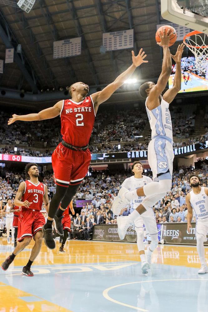 Redshirt sophomore Torin Dorn has UNC-CH Kenny Williams fly by on a breakaway for a basket. The team had one of the worst games in recent history totaling 26 turnovers and being outclassed off the glass 50-36. The Wolfpack never found their rhythm and came away with a 107-56 loss in the Dean Smith Center on Jan. 8.