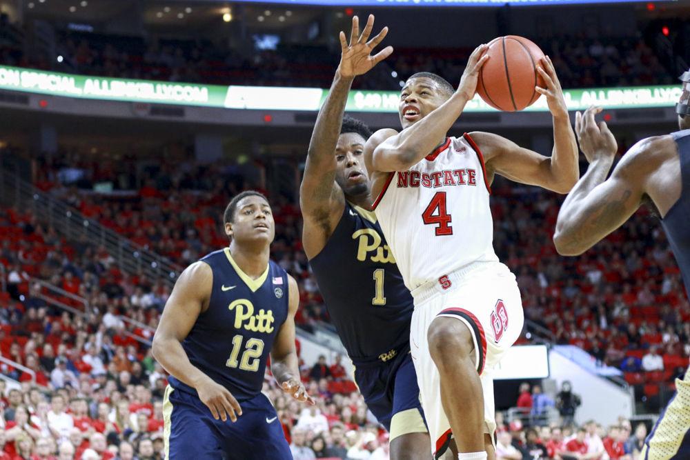 Freshman guard Dennis Smith Jr. powers through traffic to get to the basket in the Wolfpack's 79-74 win over Pittsburgh on Jan 17. Smith had 11 points and six assists in the win at PNC Arena.