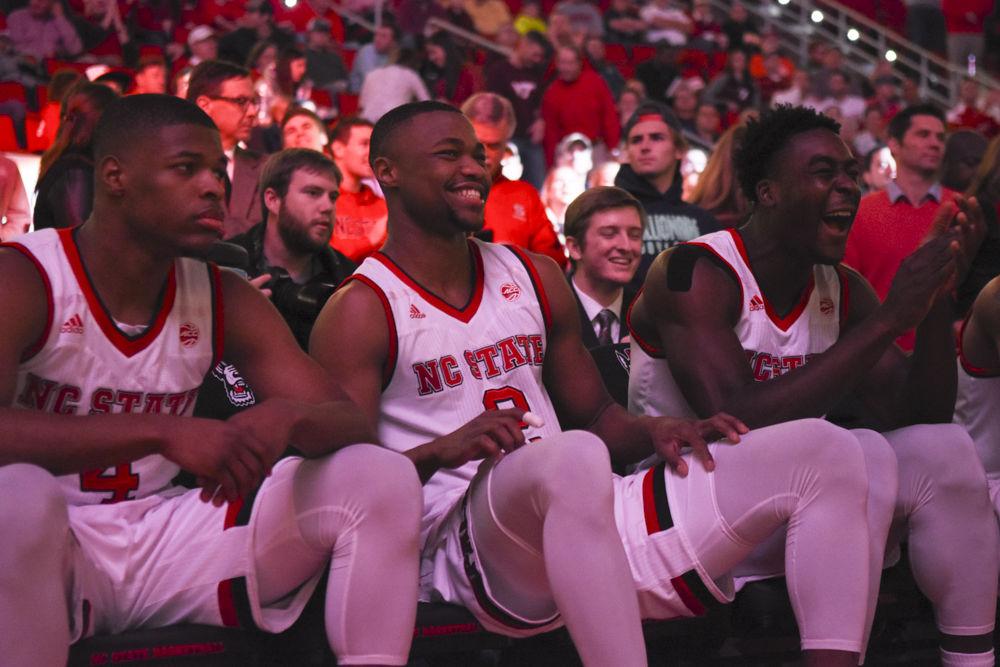 Redshirt sophomore guard Torin Dorn and junior forward Abdul-Malik Abu share a laugh after watching their pregame intro video during the Wolfpack's 104-78 win over Virginia Tech on Jan. 4, 2017.