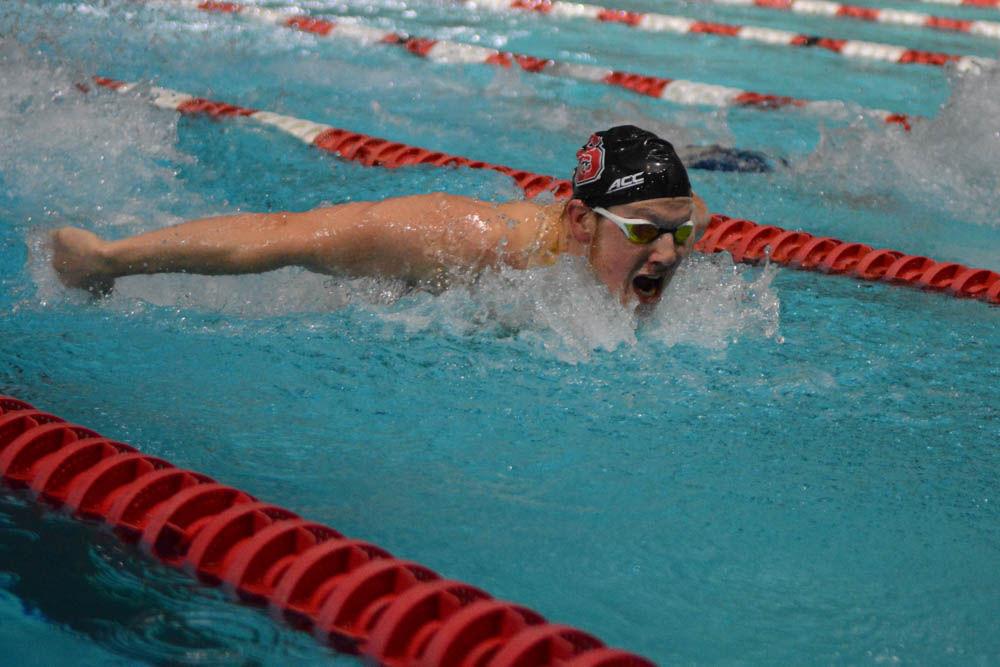 Sophmore Mason Revis swims in the 200 yard butterfly event against UNC-Chapel Hill at the Willis R. Casey Aquatic Center on Jan. 27, 2017. He finish the event with a time of 1:52.03. The Wolfpack defeated the Tar Heels in 26 of 32 events.