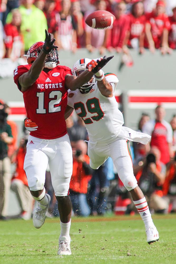 Redshirt sophomore Stephen Louis stretches out for a long pass but is dragged down by the Miami defense ending in a drop. Louis led the team with 70 yards on five receptions during the 27-13 loss to Miami on Nov. 19 in Carter-Finley Stadium.