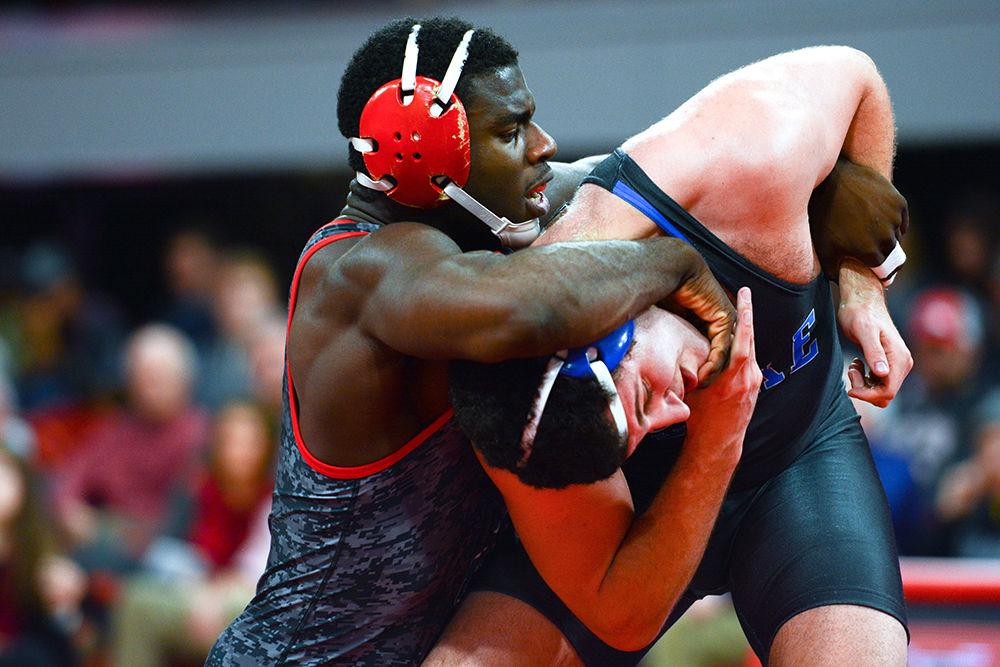 Redshirt sophomore Malik McDonald holds the head of his Duke opponent. Weighing in at 197 lbs., McDonald won his match 17-8. The NC State wrestling team beat Duke 34-6 in the ACC opener at Reynolds Coliseum on Jan. 11.